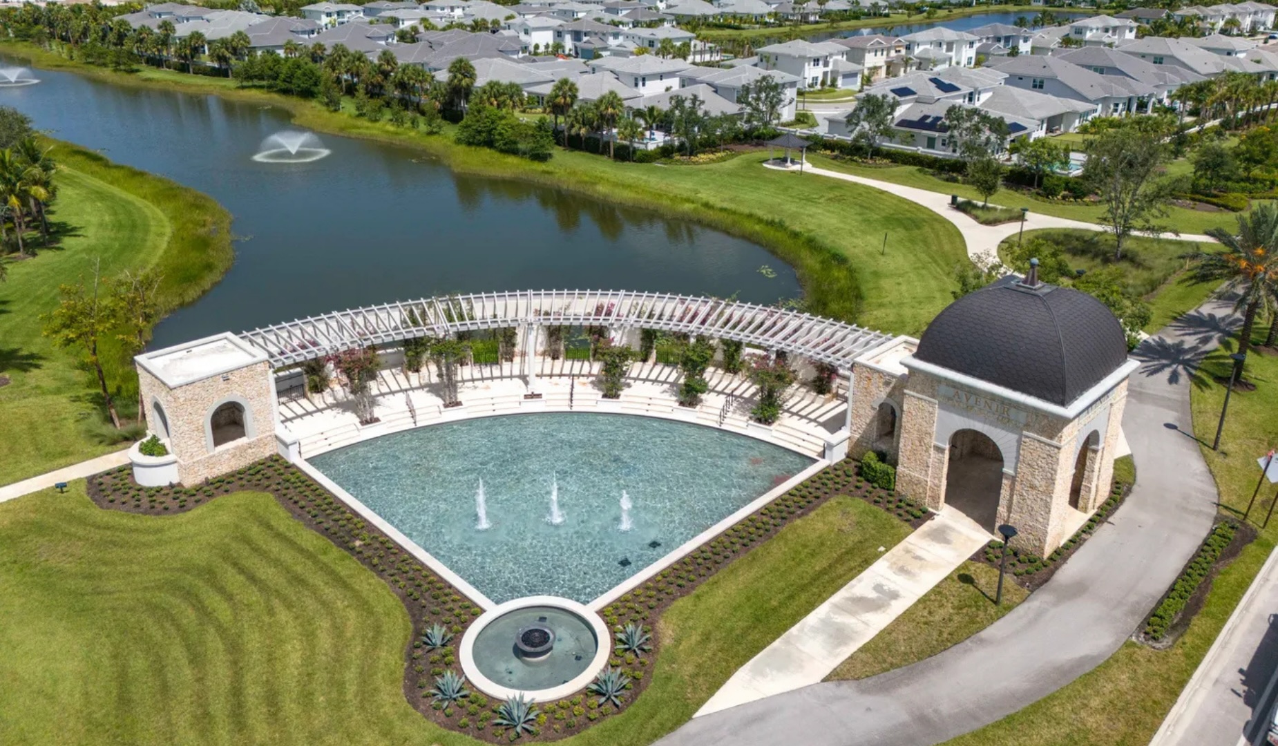 Aerial view of the Avenir community lake and fountain feature in Palm Beach Gardens, Florida